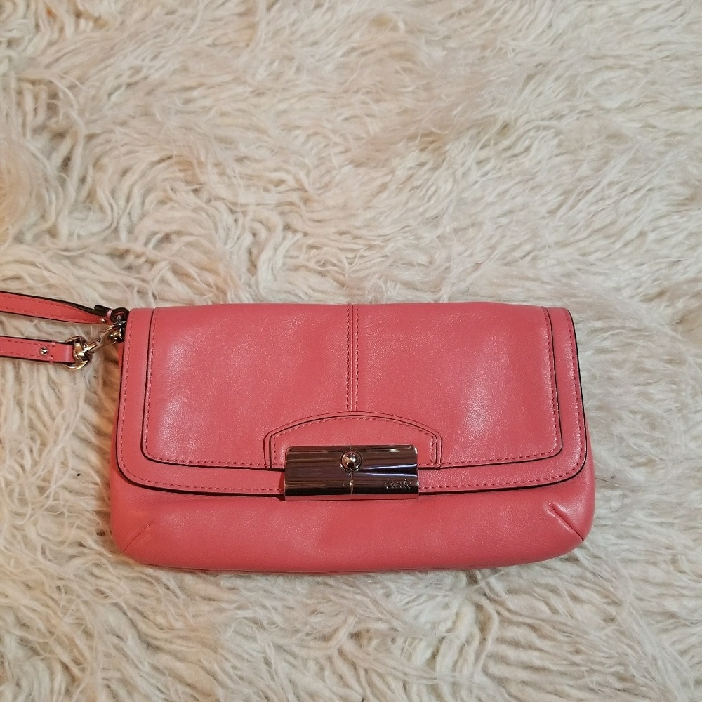 Pink coach clutch